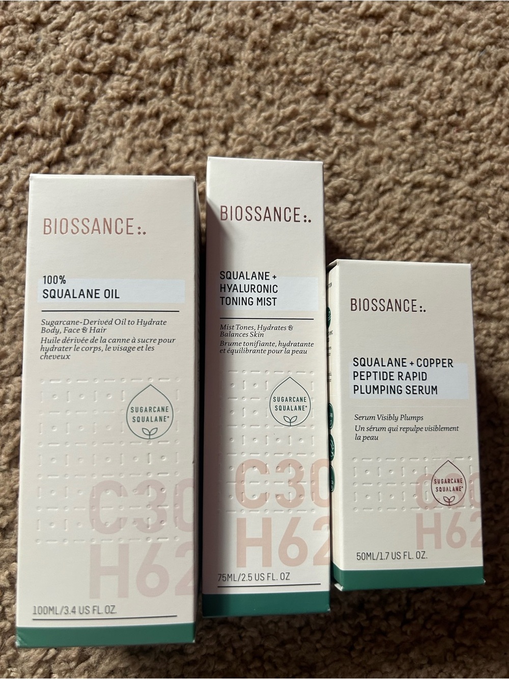 Biossance Skincare Trio in White and Green Accents